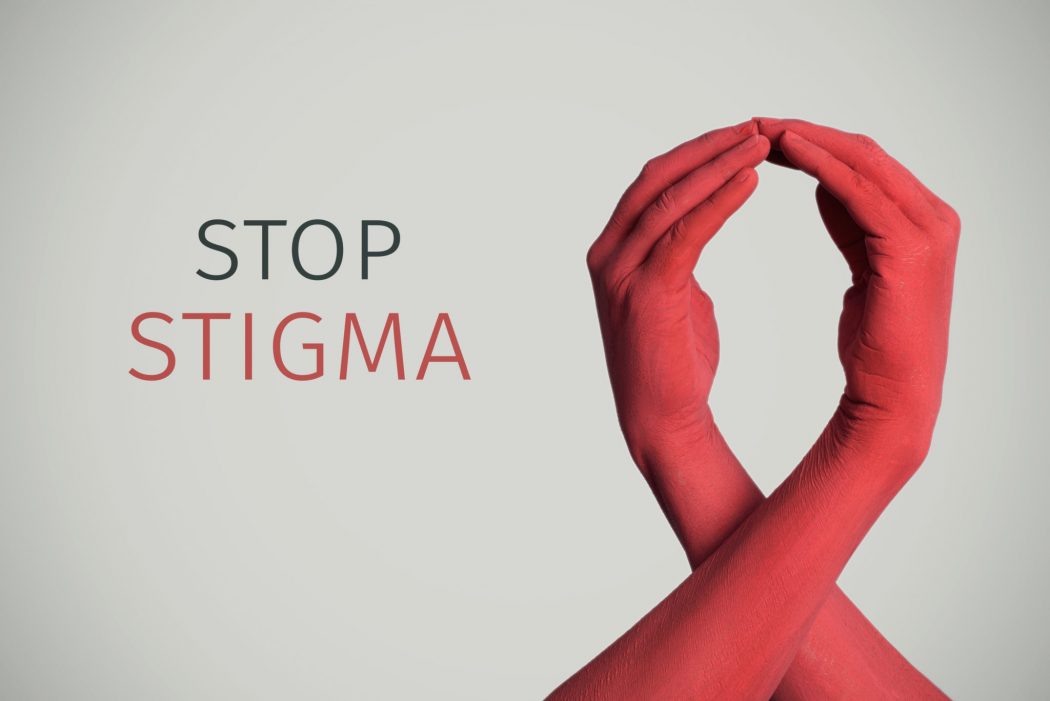 red awareness ribbon and text stop stigma
